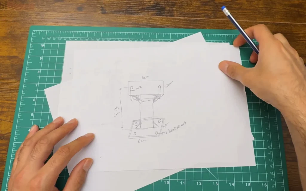 Pencil sketch of the stronger mount with 6 cm top and foot, 52 mm hole spacing, 7.5 cm height, gussets and M3 heat-set inserts