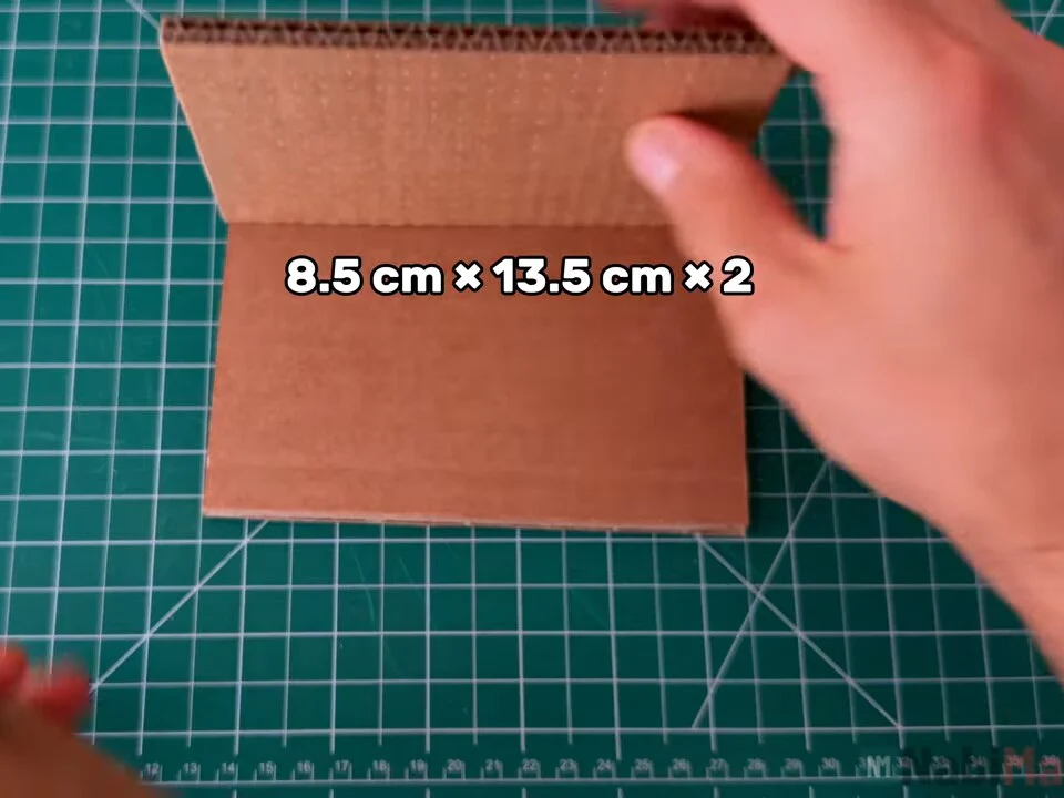 Two cardboard side panels, 8.5 cm × 13.5 cm, on the cutting mat