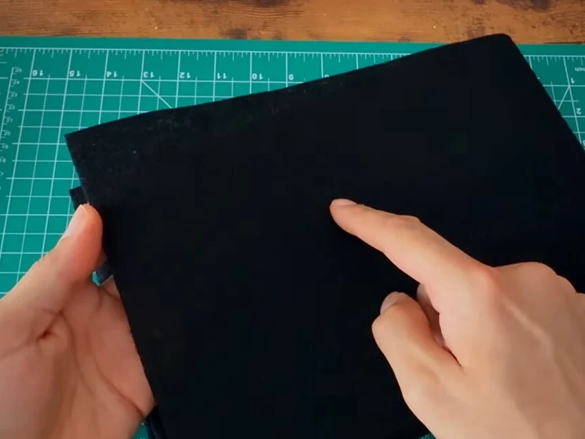 Black activated carbon filter sheet on the cutting mat