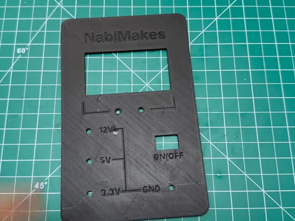 Unfinished black 3D-printed front panel with engraved labels