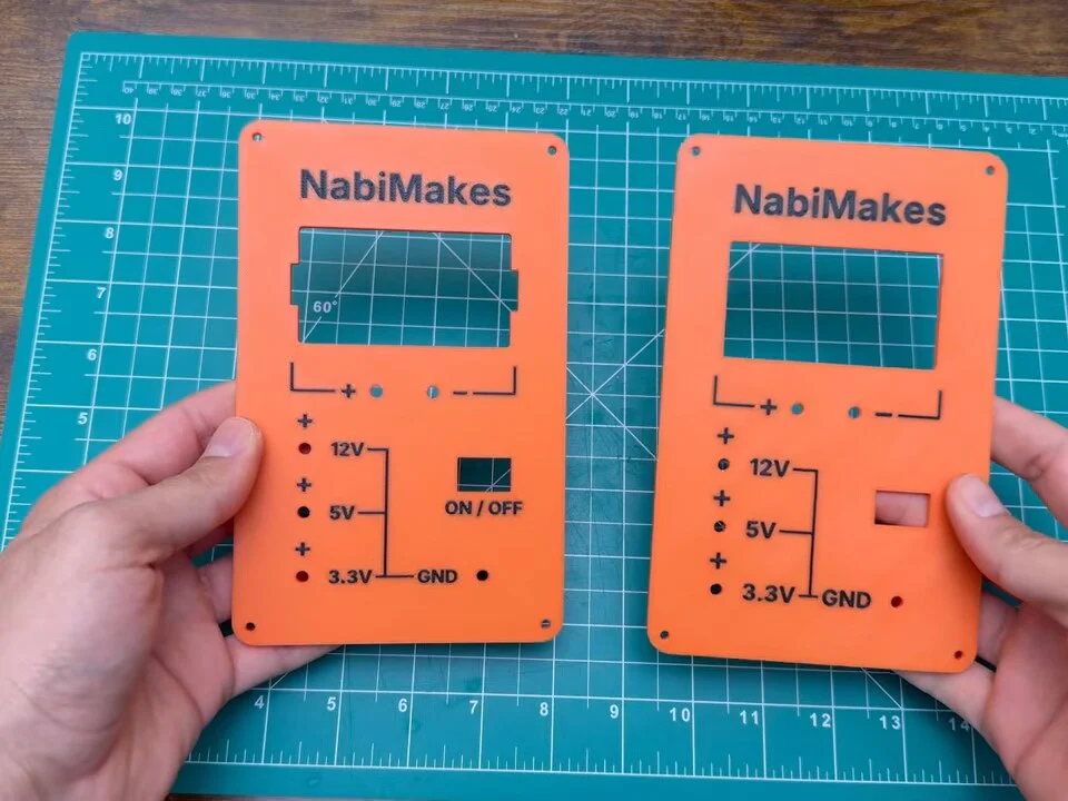 First and second printed front panels side by side, showing the larger module cut-out on the new one