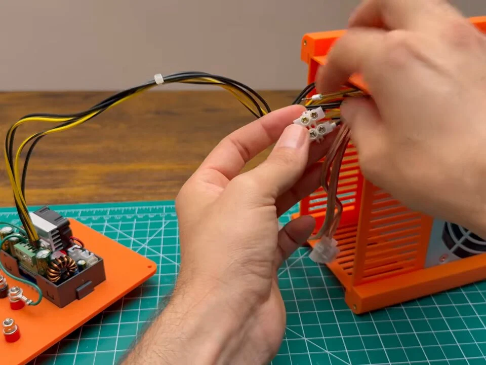 Connecting the power supply wires to a screw terminal block near the framed power supply