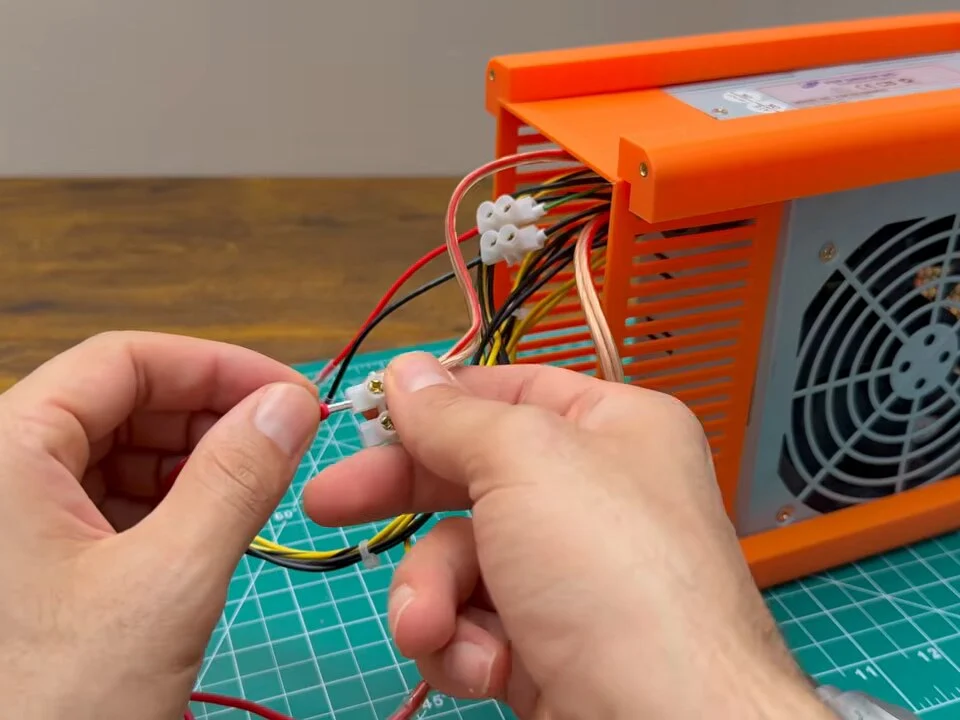 Joining the front-panel wires to the power supply wires at a terminal block
