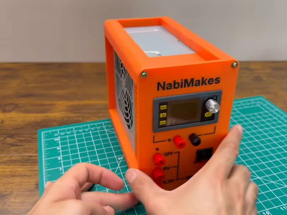Finished orange bench power supply on the cutting mat
