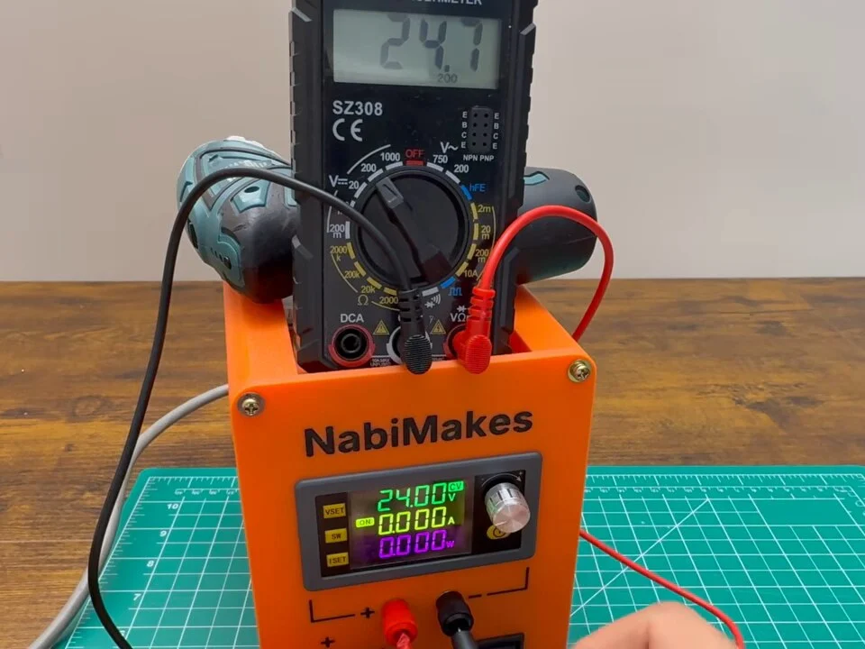 Multimeter reading 24.1 V from the variable output, with the SK120 display set to 24 V
